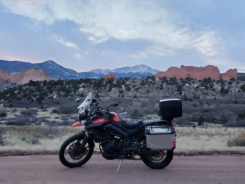 A motorcycle parked on a road

Description automatically generated